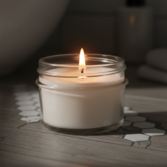 Clear glass jar candle on a counter
