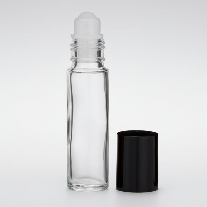 Clear glass roller bottle with a black cap on a white background