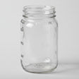 Clear glass mason jar on a white background