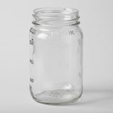 Clear glass mason jar on a white background