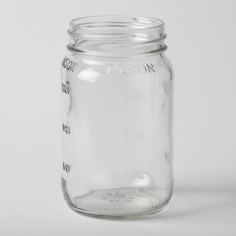 Clear glass mason jar on a white background