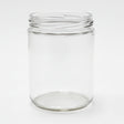 Clear glass jar on a white surface with a neutral background