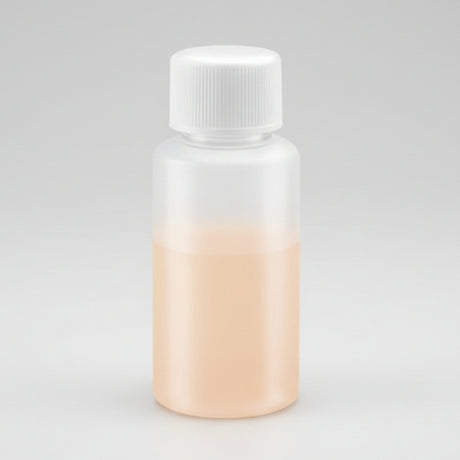 Small bottle with a white cap on a white background