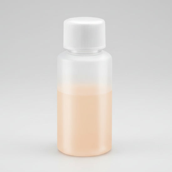 Small bottle with a white cap on a white background