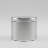Candle tin on grey background
