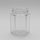 Clear glass hexagonal jar on a dark background
