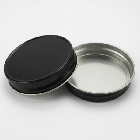 black metal lids on a white background