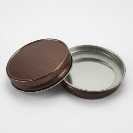 copper metal lids on a white background