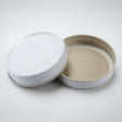 Two white mason jar lids, on a white background