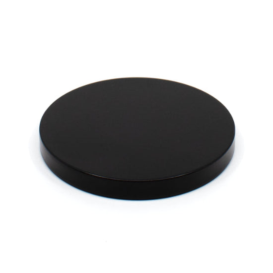 Black circular object on a white background