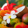 Assorted tropical fruits with flowers on a colorful background
