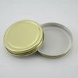 Gold metal lid a white background