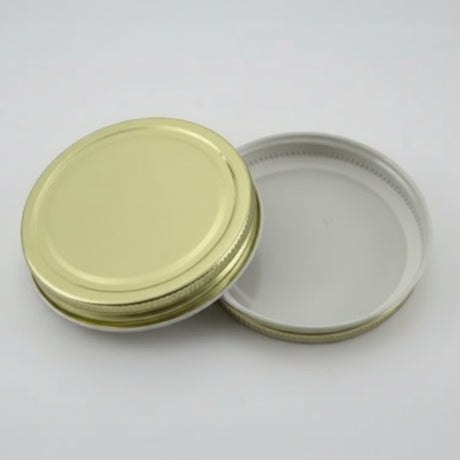 Gold metal lid a white background