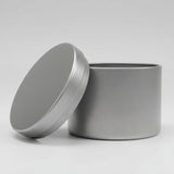 Candle tin on grey background