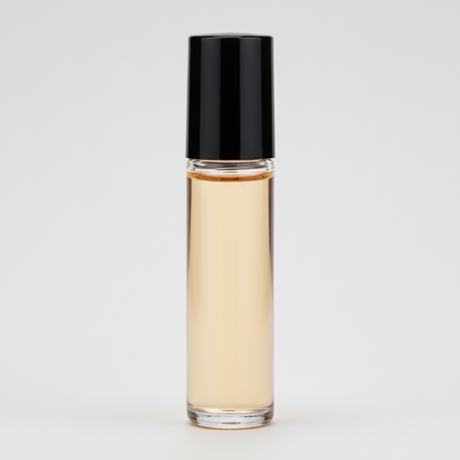 Roll-on bottle with amber liquid and black cap on a white background