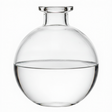 Clear glass diffuser with a round base on a white background