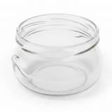Clear glass jar with a lid on a white background