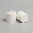 white disc lotion bottle lid