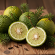 bergamot fruits mixed with spruce leaves on a cedar board. a few cloves are scattered. 