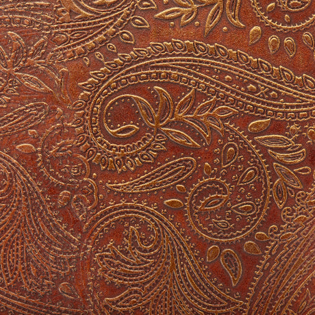 Close-up of brown leather with intricate paisley pattern