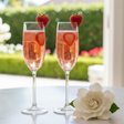 two pink strawberry mimosas