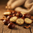 Close-up of chestnuts on a wooden surface with a blurred background