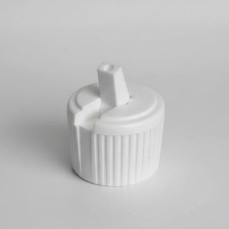 White plastic cap with a central cylindrical component on a white background
