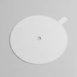 White circular object with a central hole on a gray background